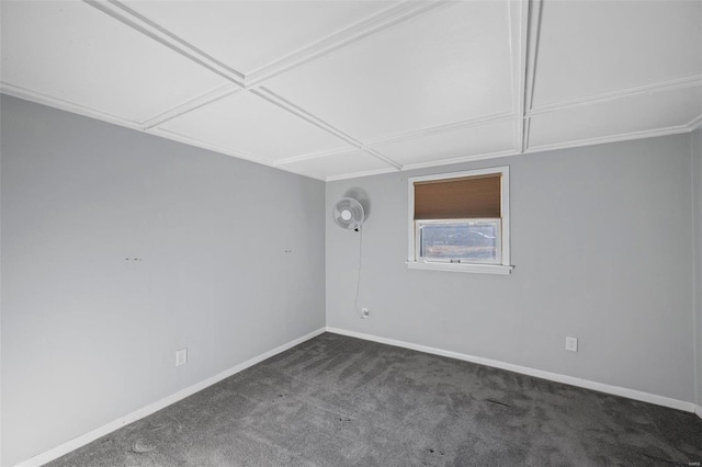 empty room featuring baseboards and carpet