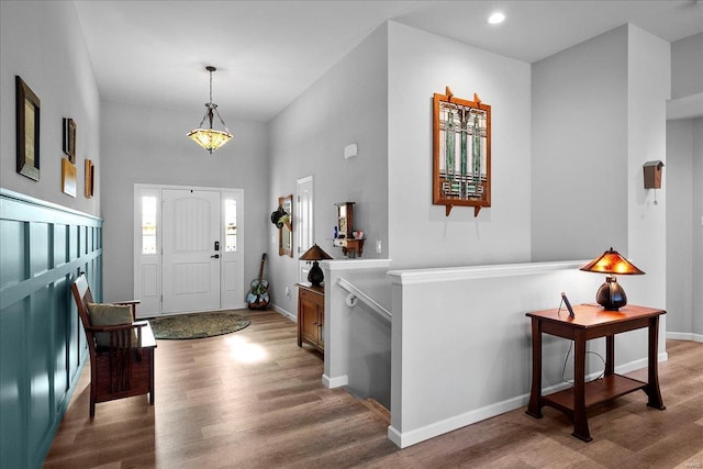 entrance foyer with recessed lighting, baseboards, and wood finished floors