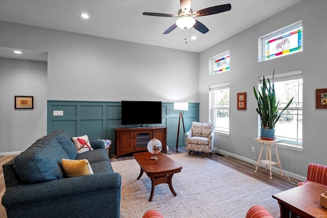 living area with visible vents, baseboards, ceiling fan, recessed lighting, and wood finished floors