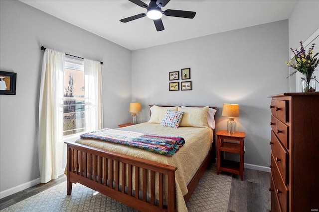 bedroom featuring a ceiling fan and baseboards