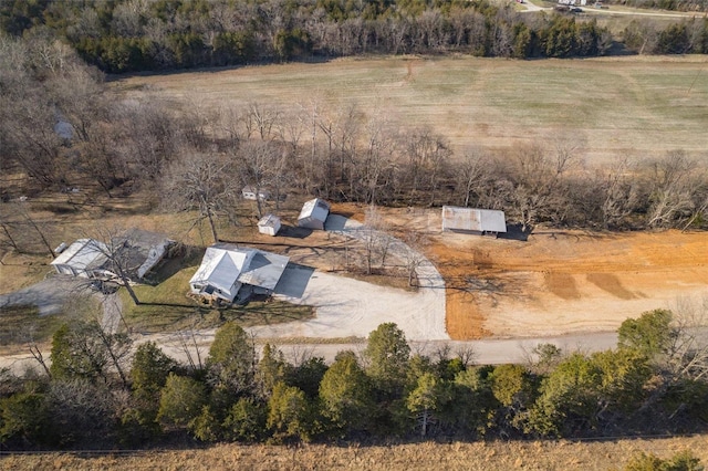 birds eye view of property with a rural view