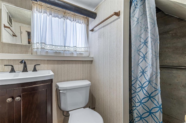 bathroom featuring a shower with curtain, toilet, and vanity