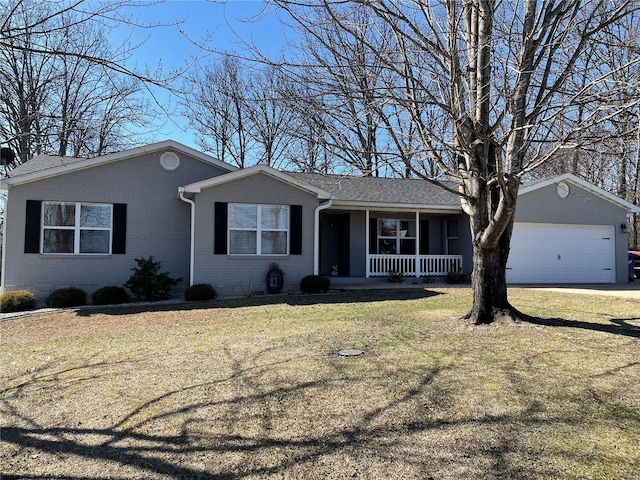 single story home with a porch, a garage, brick siding, and a front lawn