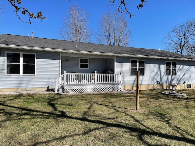 view of front of house with a deck, a front yard, and crawl space