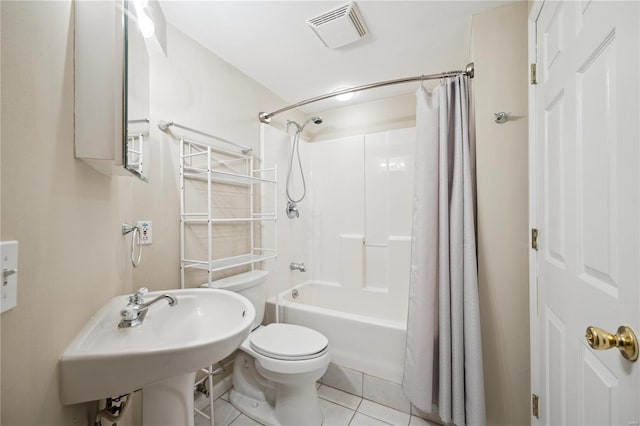 bathroom with tile patterned floors, visible vents, shower / bathtub combination with curtain, toilet, and a sink