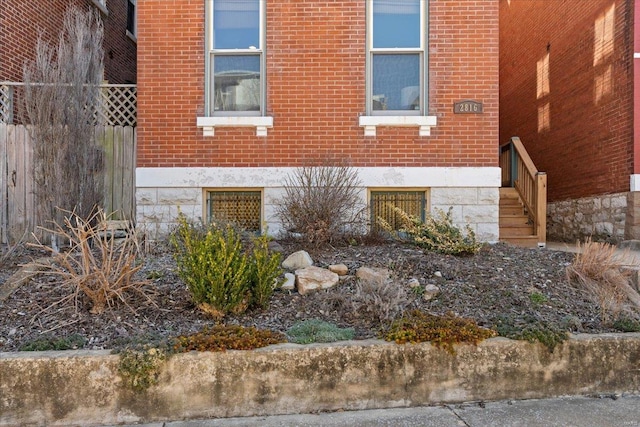 view of side of home featuring brick siding