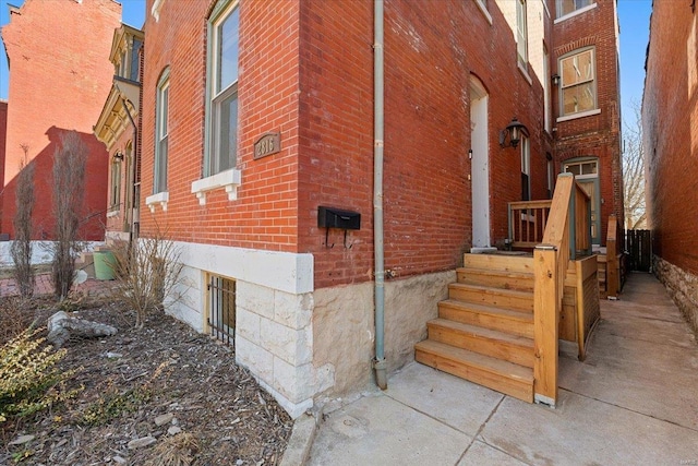 view of side of property with brick siding