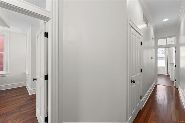 hall with recessed lighting, baseboards, dark wood-style floors, and crown molding