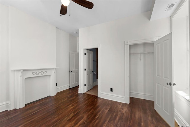 unfurnished bedroom with visible vents, baseboards, and wood finished floors