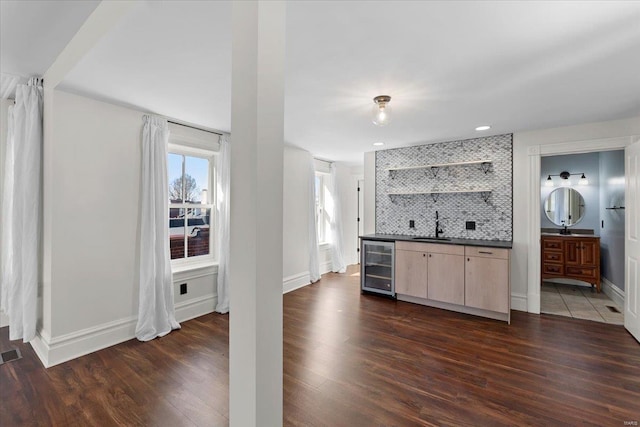 kitchen featuring dark countertops, visible vents, beverage cooler, decorative backsplash, and open shelves