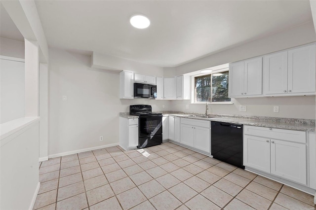 kitchen featuring white cabinetry, black appliances, light tile patterned floors, and a sink