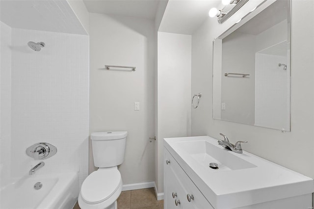 full bathroom featuring tile patterned flooring, tub / shower combination, baseboards, toilet, and vanity