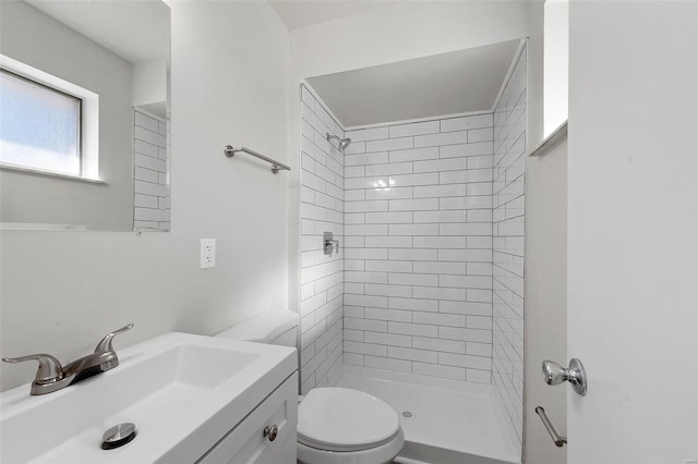 full bath with toilet, a stall shower, and vanity