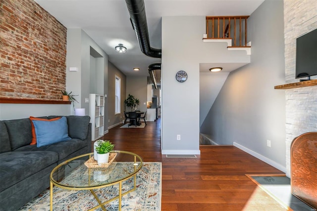 living room featuring wood finished floors and baseboards