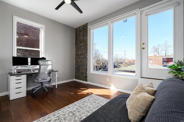 office area featuring ceiling fan, baseboards, and wood finished floors