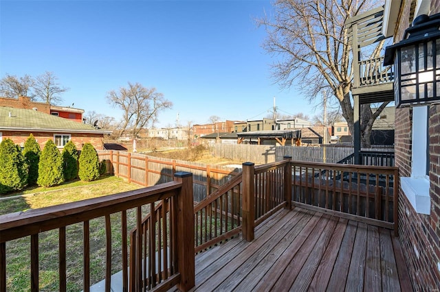 deck with a fenced backyard