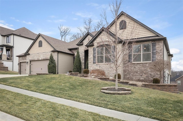 view of front of home featuring a front yard, driveway, an attached garage, stone siding, and brick siding