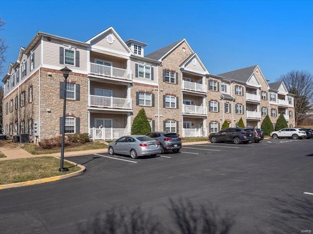 view of property with uncovered parking