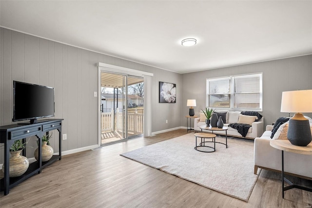 living area featuring wood finished floors and baseboards