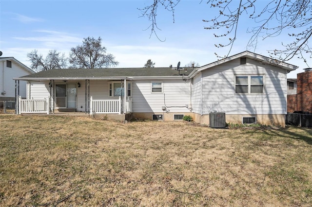 back of house featuring central air condition unit, a lawn, and a porch