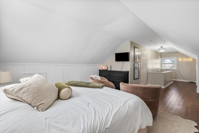 bedroom with dark wood-type flooring and vaulted ceiling