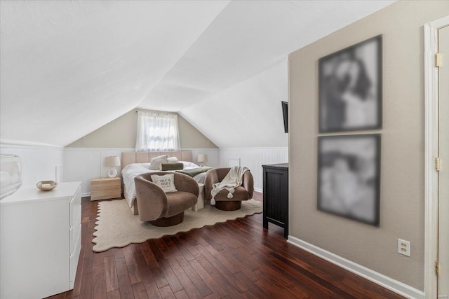 bedroom featuring lofted ceiling and dark wood-style flooring