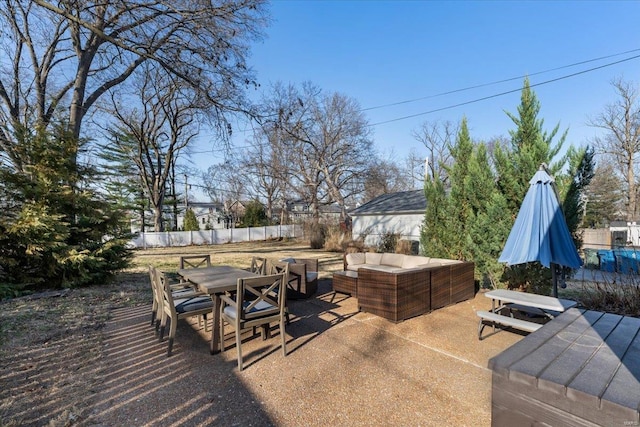 view of patio with outdoor dining area, outdoor lounge area, and fence