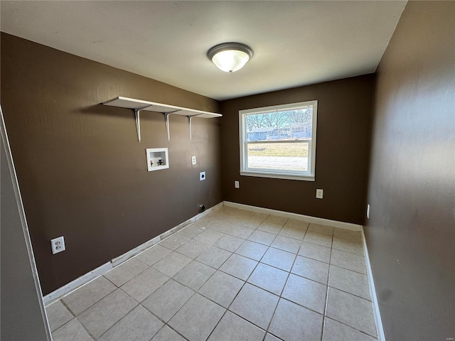 washroom featuring washer hookup, laundry area, light tile patterned flooring, and baseboards