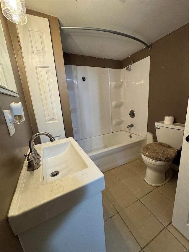 full bathroom featuring vanity, tile patterned floors, toilet, and bathing tub / shower combination