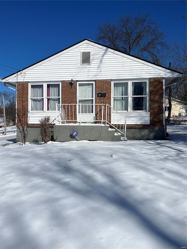 view of front of property featuring brick siding