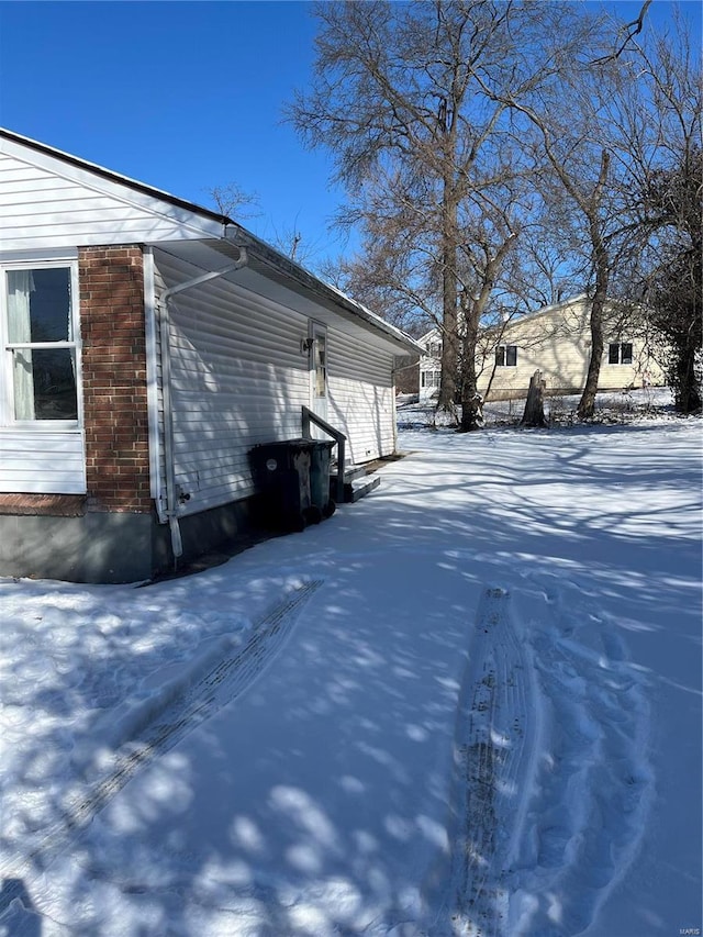 view of snow covered property