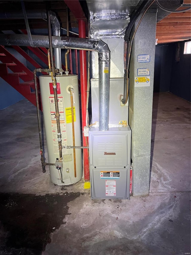 utility room featuring gas water heater