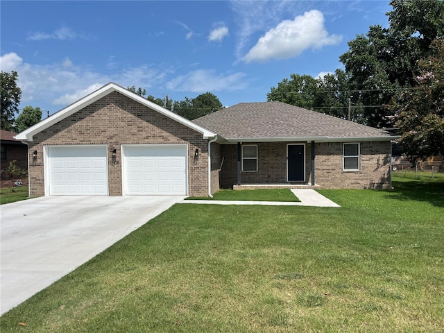 ranch-style house featuring brick siding, driveway, an attached garage, and a front lawn