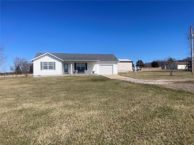 ranch-style home featuring a front lawn, a garage, driveway, and crawl space