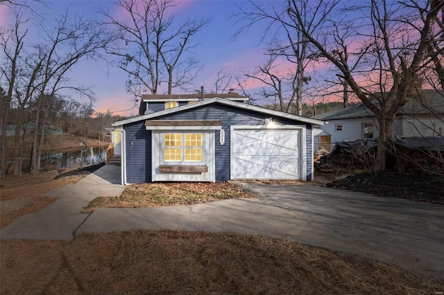 view of front facade with driveway and a garage