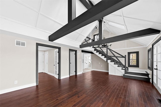 unfurnished living room with visible vents, baseboards, stairway, beamed ceiling, and hardwood / wood-style floors