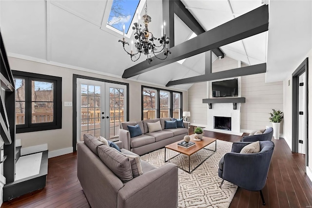 living area featuring baseboards, beam ceiling, french doors, a fireplace, and dark wood-style flooring