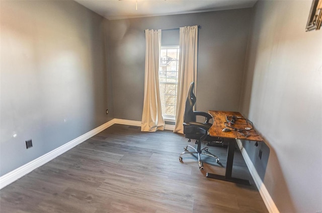 office featuring baseboards and wood finished floors