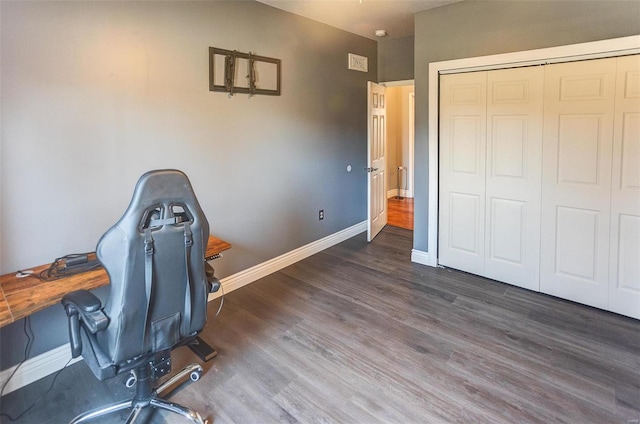 office space featuring wood finished floors and baseboards