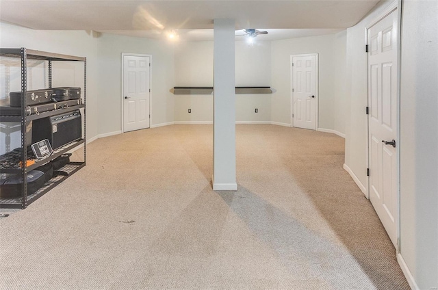 basement with carpet and baseboards