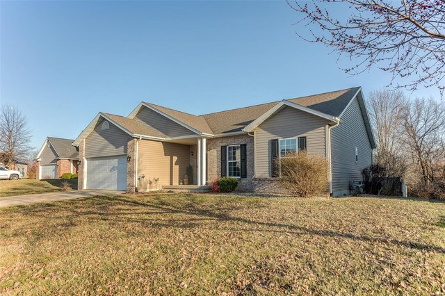 single story home featuring brick siding, an attached garage, concrete driveway, and a front yard