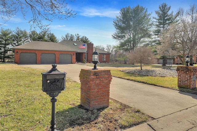 view of front of house with a front lawn, an attached garage, brick siding, and driveway