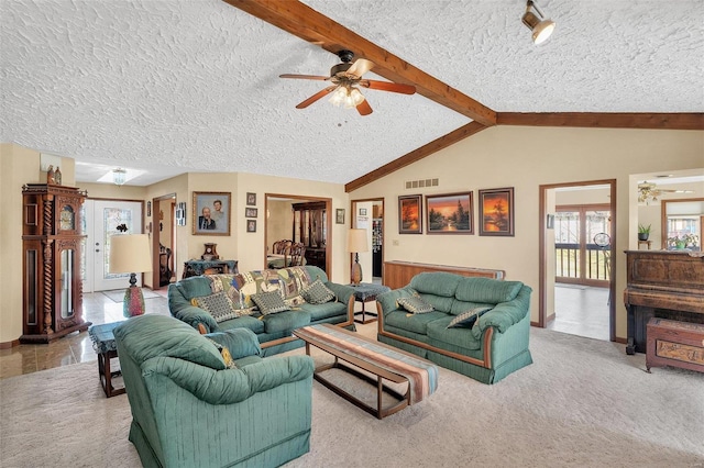 carpeted living area with lofted ceiling with beams, visible vents, a textured ceiling, and a ceiling fan