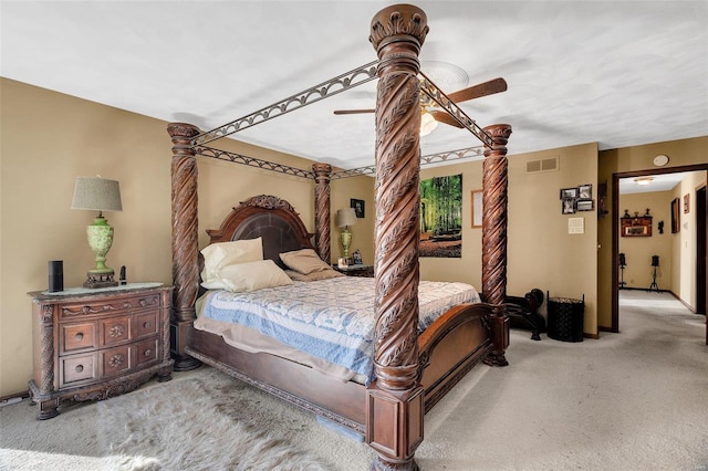 carpeted bedroom featuring visible vents and ceiling fan