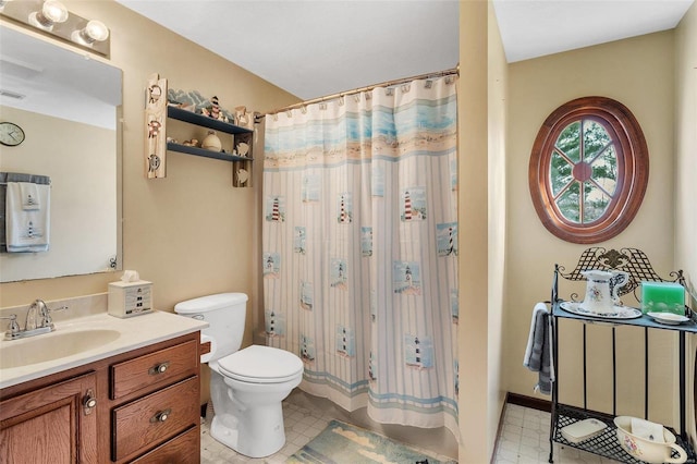 bathroom featuring tile patterned floors, visible vents, toilet, and vanity