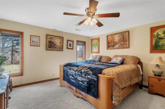 bedroom featuring visible vents, baseboards, carpet, and ceiling fan