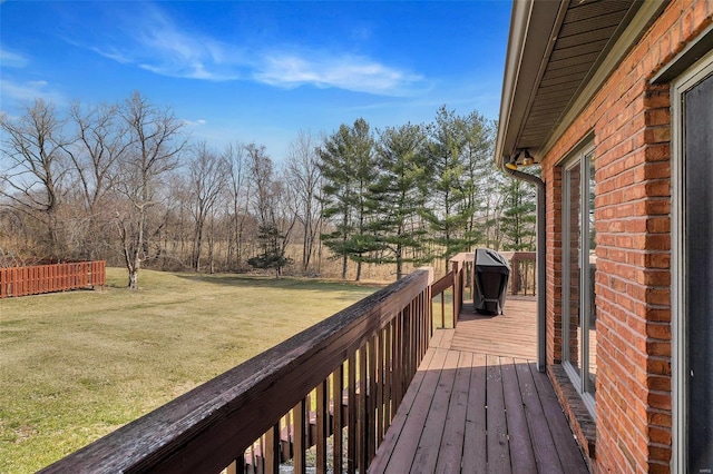 wooden terrace with a yard