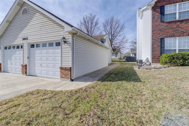 view of property exterior featuring a garage, a yard, and brick siding