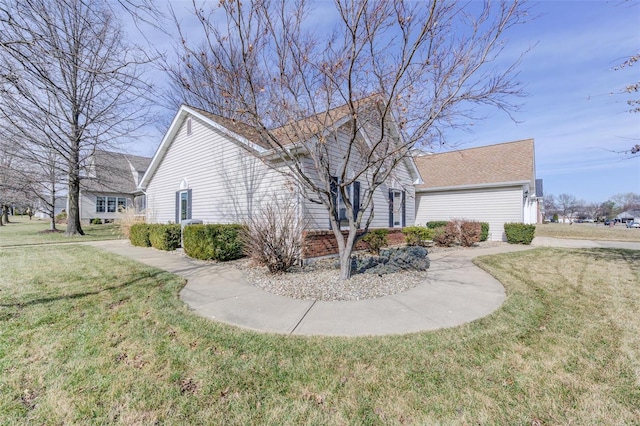 view of side of property featuring a lawn