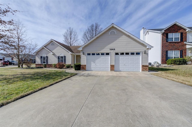 view of front of home with a front yard, an attached garage, brick siding, and driveway